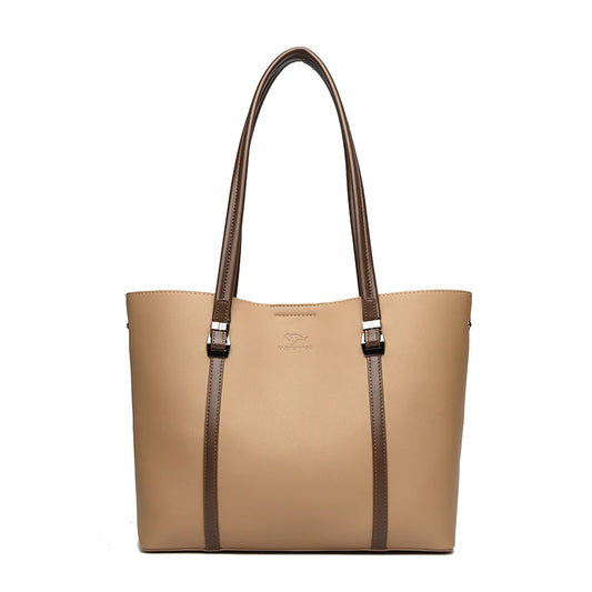 Beige handbag with brown straps on a white background