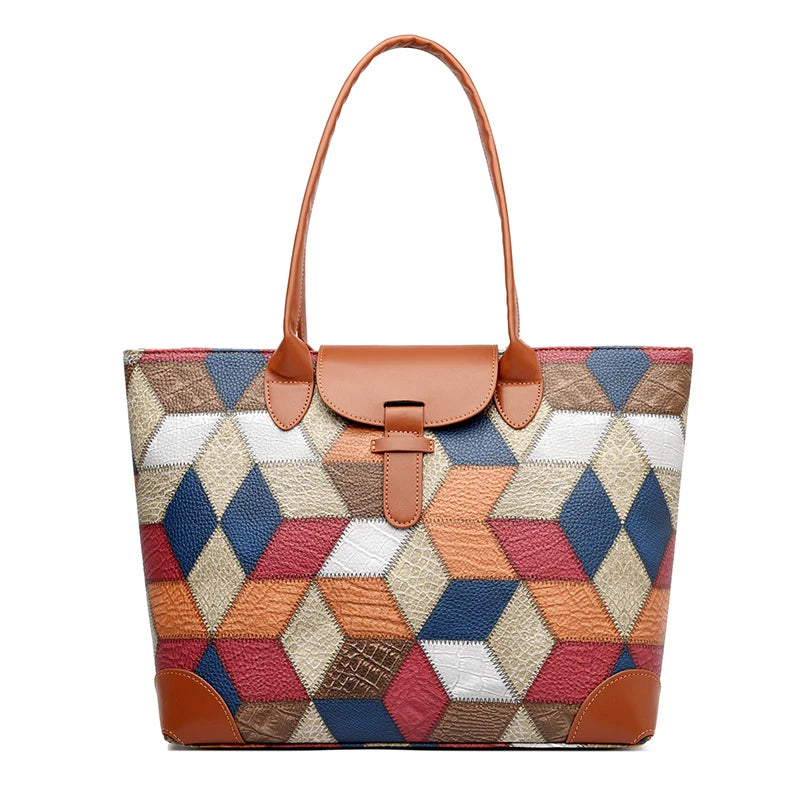 Multicolored geometric patterned handbag with brown leather accents on a white background