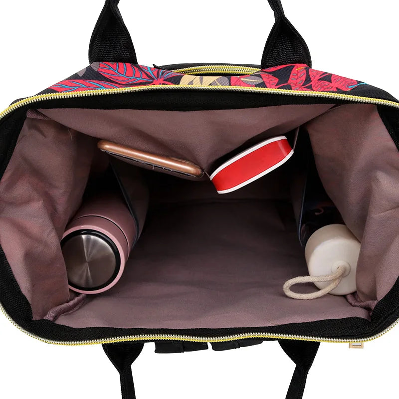 Mochila con bolsa de pañales de flores