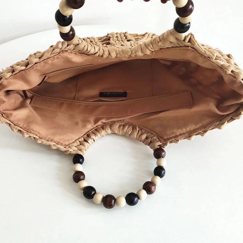 Bolso de paja con pompones