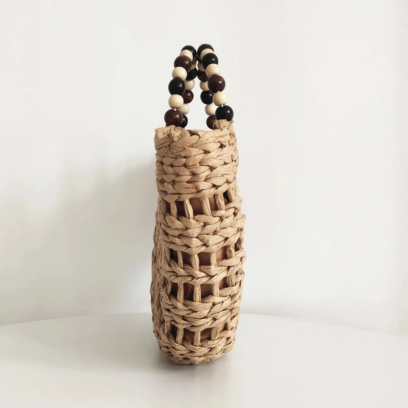 Bolso de paja con pompones
