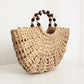 Bolso de paja con pompones