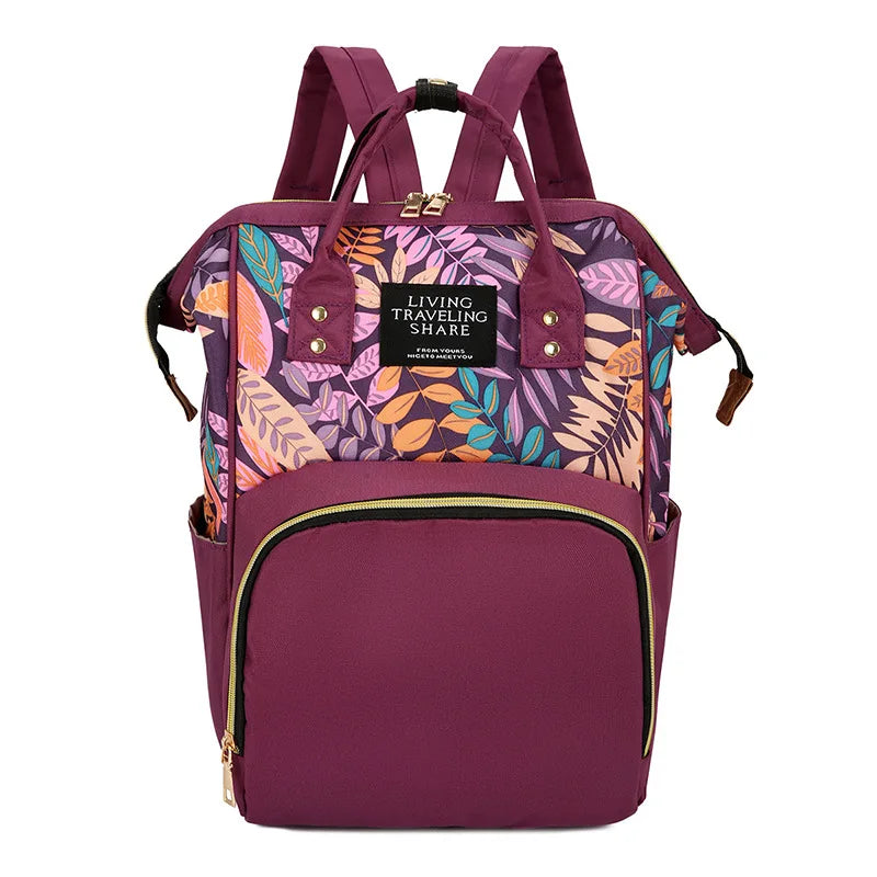 Mochila con bolsa de pañales de flores