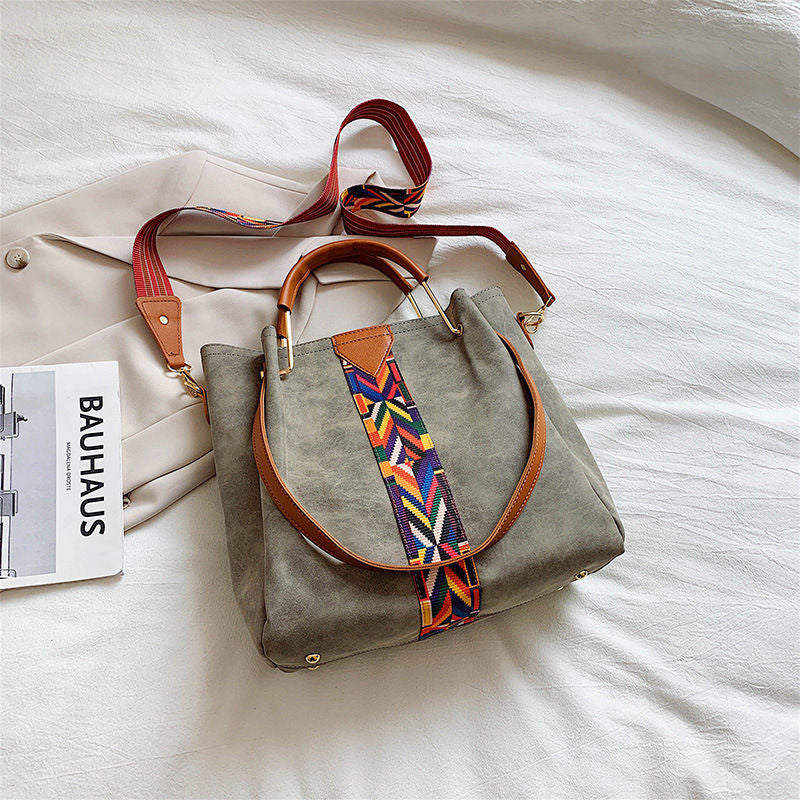 designer crossbody bag with guitar strap